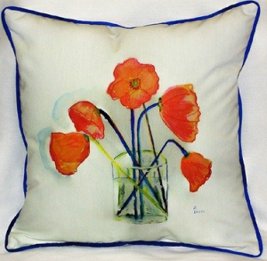 Throw pillows with the popular tangerine color add pops of color in your rooms