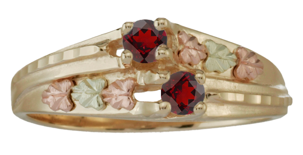 10k yellow gold double garnet ring with 12k green and rose gold Black Hills Gold motif.