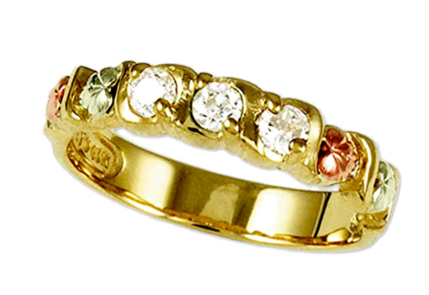 Tri-color Gold Three Stone anniversary ring with Black Hills Gold motif.