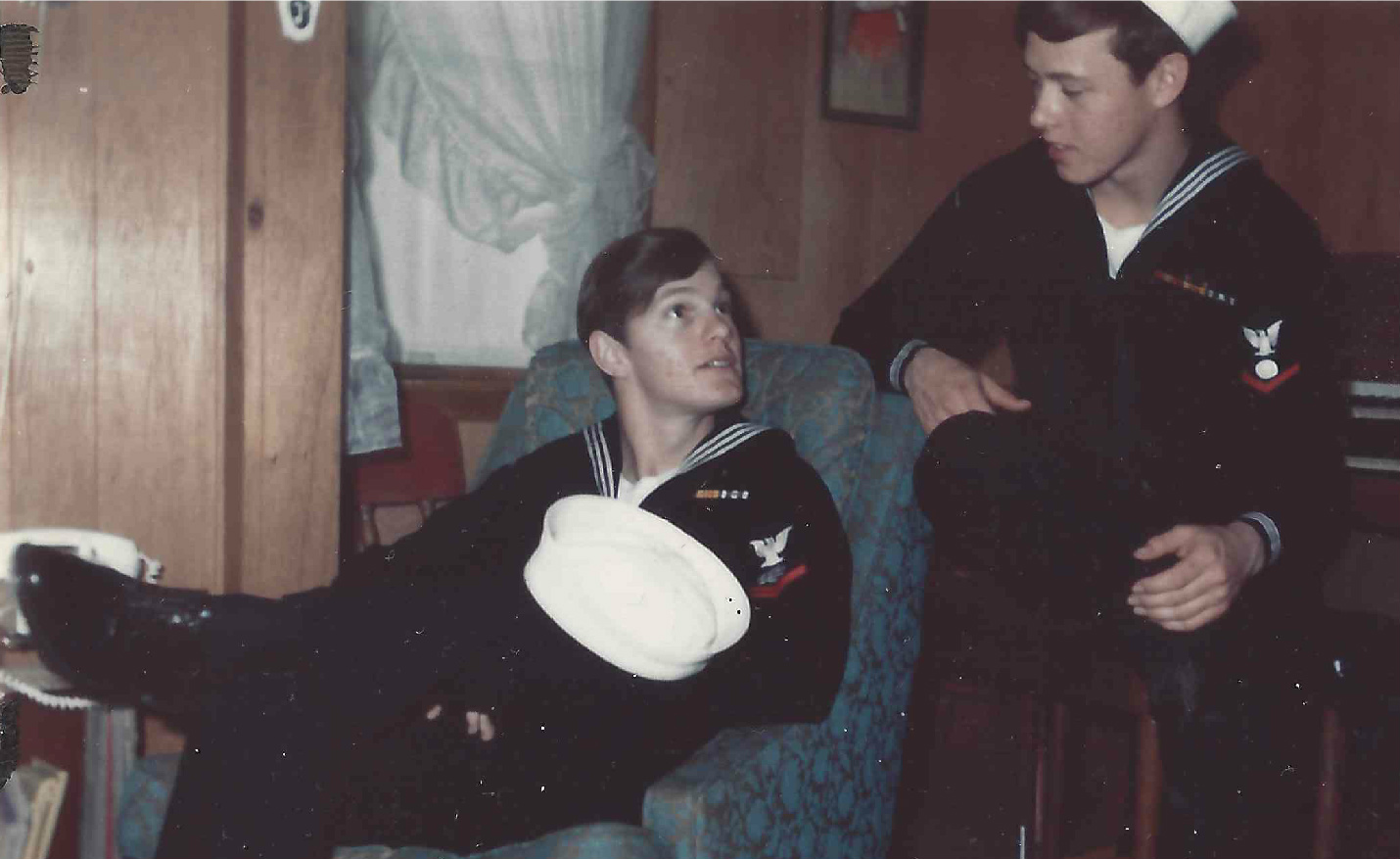 Brothers, Mike Young sitting down in blue chair, Dan Young on right. They both served at the same time and after a year of requests they were able to serve together on the U.S.S. Chicago in 1969 to 1970.