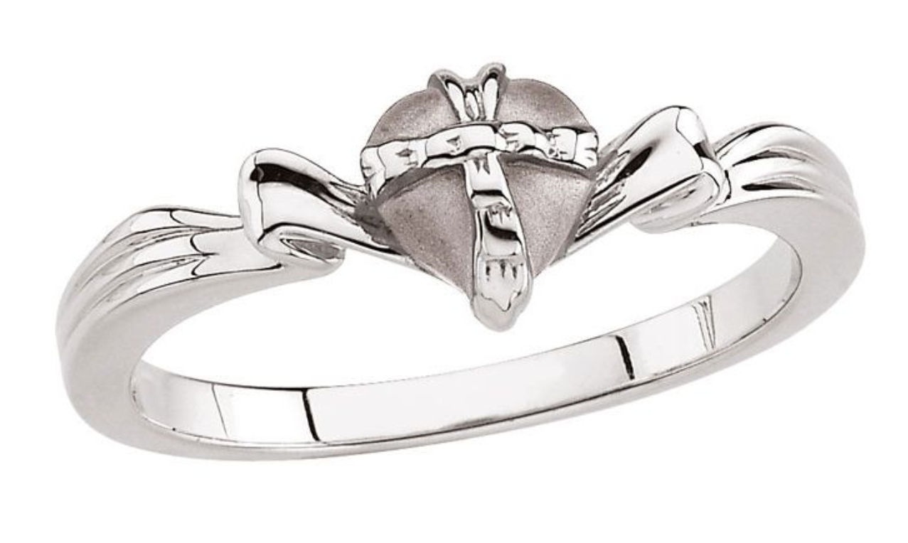 Raised Cross on Heart Ring Offered in Continuum Silver, Sterling Silver and White Gold. 