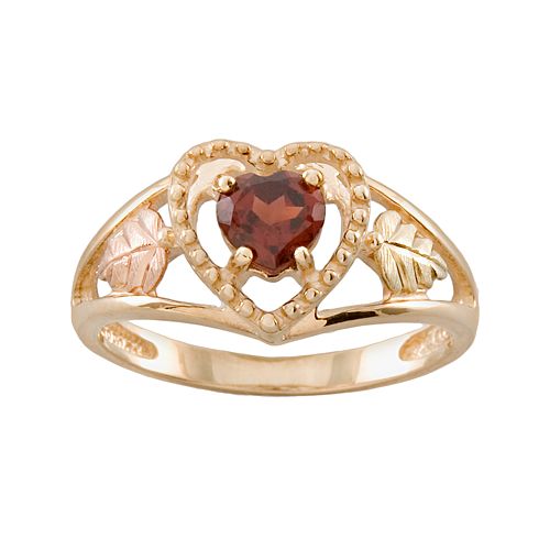 Heart shaped garnet in granulated trim setting with cut-out Black Hills Gold motif tri-color gold.