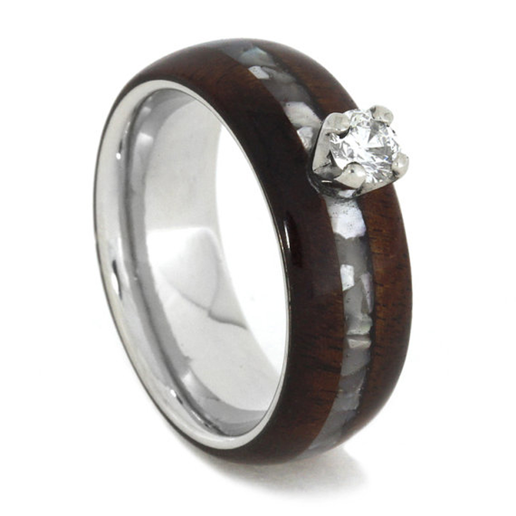 Hand crafted diamond solitaire engagement ring with inlaid mother of pearl on center of exotic Honduran wood over a comfort-fit, lightweight titanium sleeve.