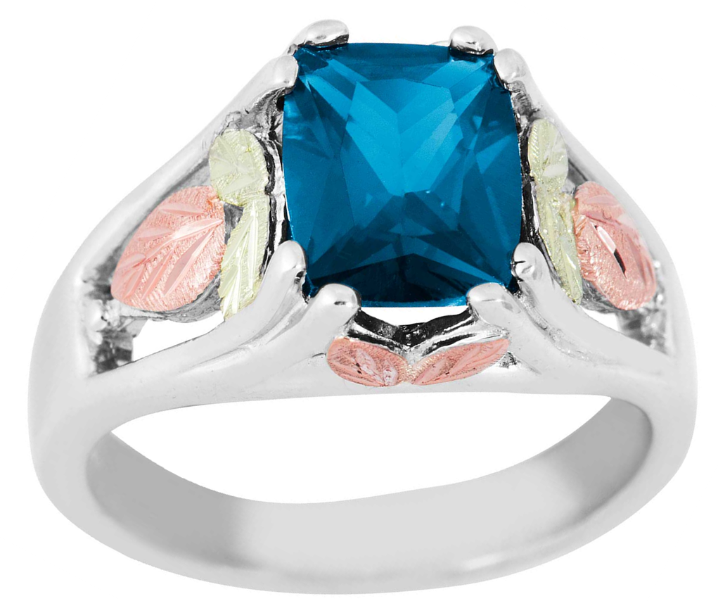 Created Blue Zircon December birthstone rhodium plate sterling silver, 12k rose gold, 12k green gold Black Hills Gold motif.