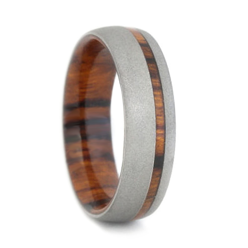 Sandblast titanium with a peek a boo pinstripe of ironwood, the exotic ironwood is also the comfort-fit band that slides onto your finger. It is a very comfortable and light weight, eco-friendly ring.