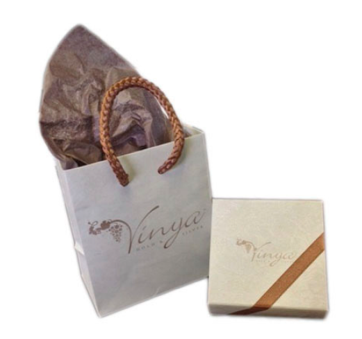 The finishing touches; each handcrafted piece of jewelry has a matching gift box, matching tote bag and tissue paper.