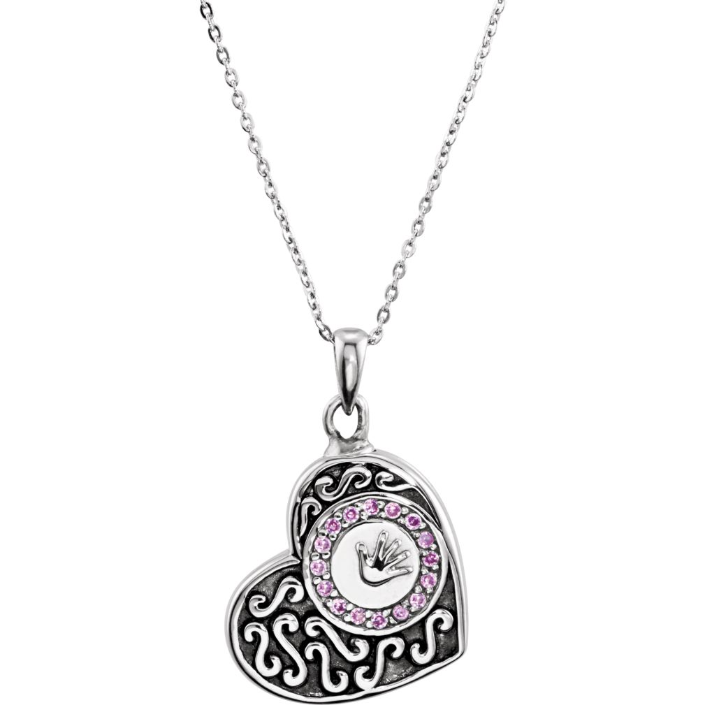 Girls antiqued heart ash holder with a hand print encircled by pink cubic zirconias and antiqued scroll work on the pendant necklace. Ash holder comes with a funnel, Allen wrench, glue, spoon and a black velour pouch. The cremation vessel arrives packaged in a gift box, perfect for gift giving.
